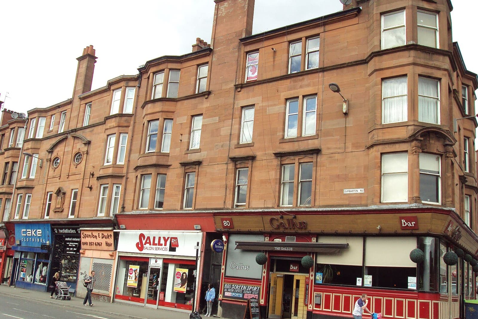 Sandstone tenements and shops on Dumbarton Road in Partick, Glasgow